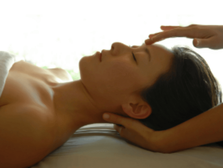 woman receiving reiki energy healing